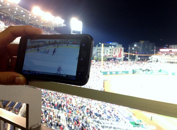 Watching hockey at baseball game
